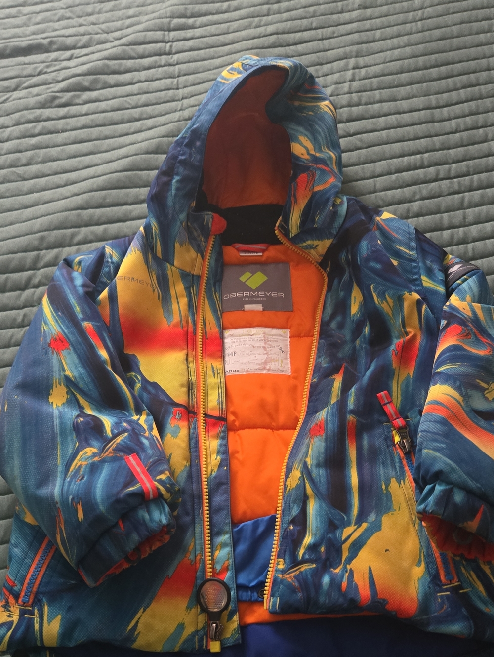 Obermeyer Kids Hooded Puffer Jacket in Blue, Yellow & Orange